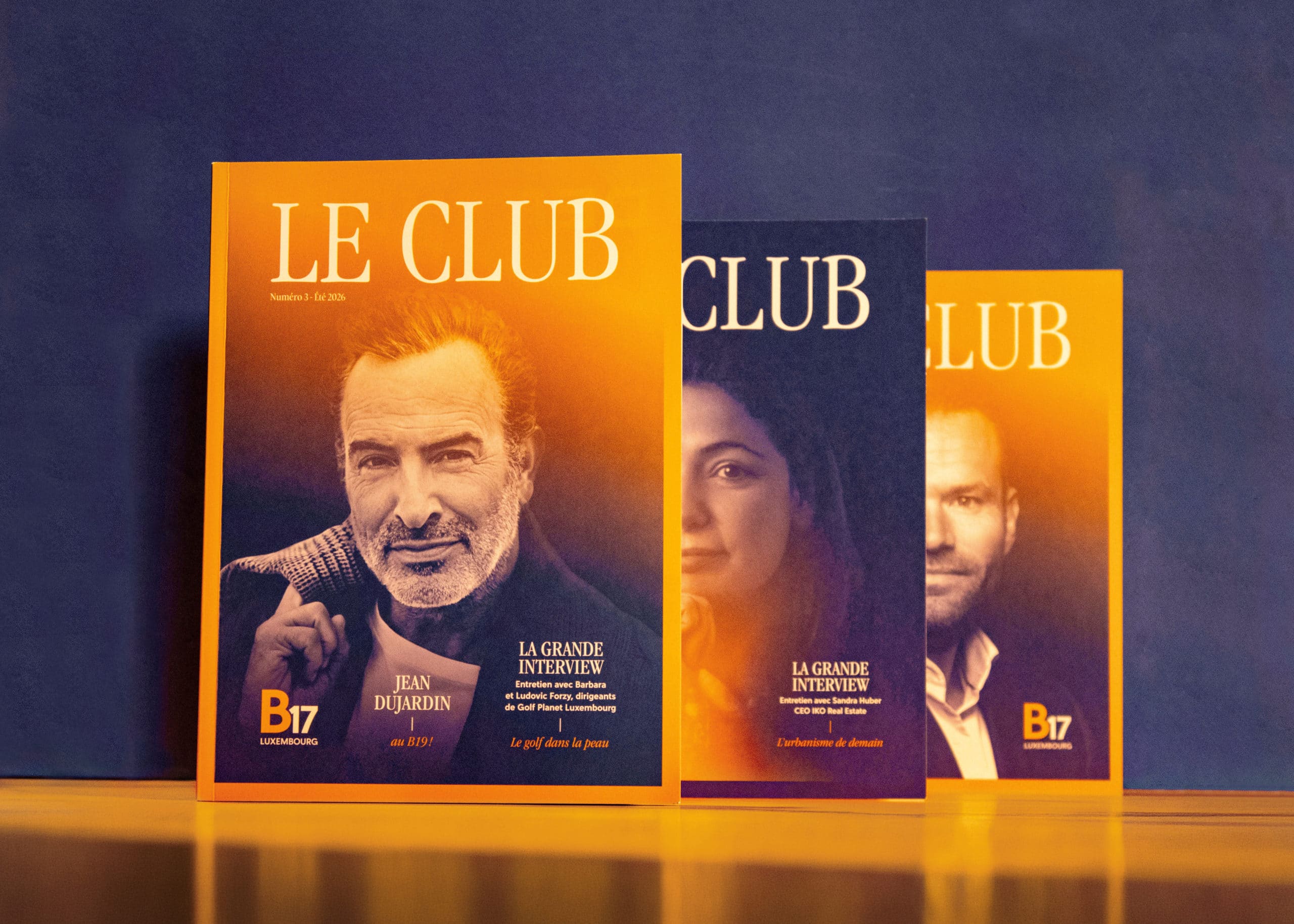 Couvertures du magazine Le Club édité par le B17 Luxembourg, dont une édition mettant en avant l'acteur Jean Dujardin.